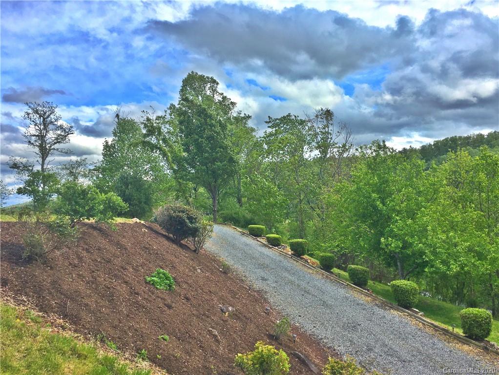 2156 Orchard Road, Unit 1 & 2 Deep Gap, NC 28618 - Photo 10 of 33 a backyard of a house with lots of green space