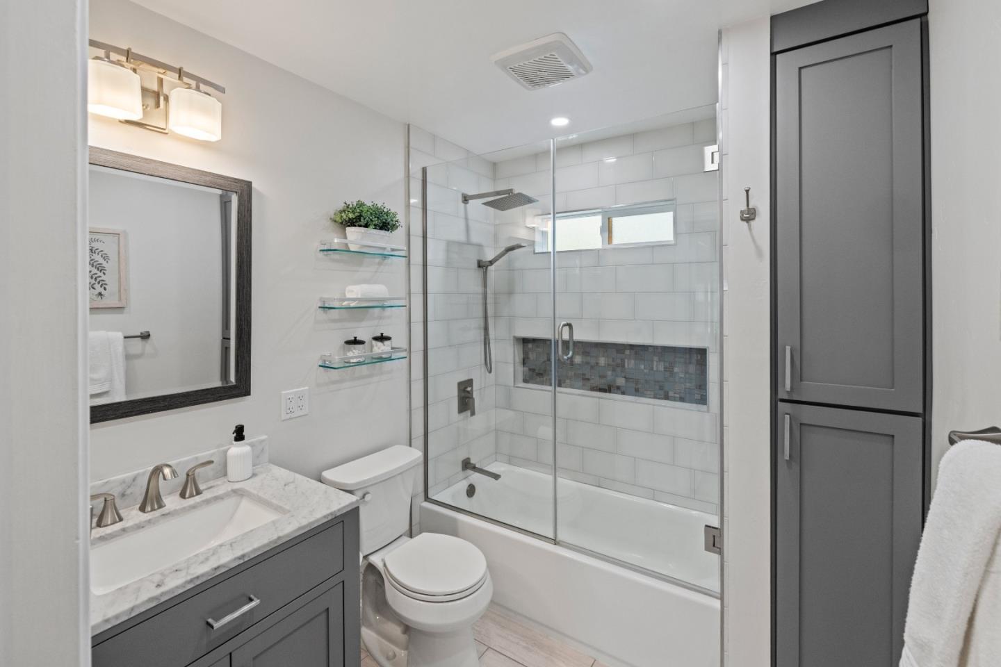209 Orange Drive Salinas, CA 93901 - Photo 11 of 18 a bathroom with a granite countertop sink toilet and shower