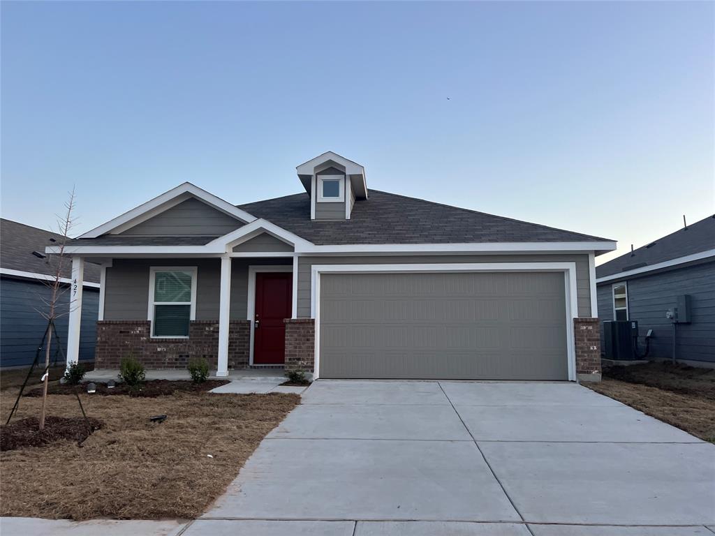 427 Ashbrook Way Princeton, TX 75407 - Photo 1 of 25 a front view of a house with a yard and garage