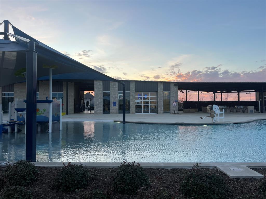 427 Ashbrook Way Princeton, TX 75407 - Photo 16 of 25 a view of a swimming pool with outdoor seating