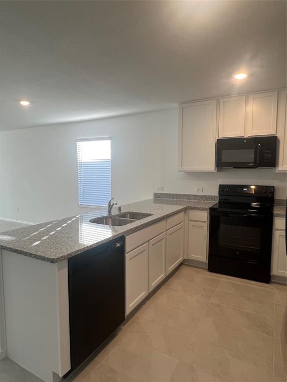 427 Ashbrook Way Princeton, TX 75407 - Photo 3 of 25 a kitchen with stainless steel appliances granite countertop a sink and a stove