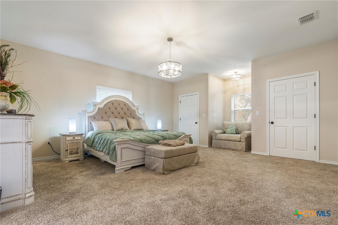 114 Deer Run Moody, TX 76557 - Photo 16 of 40 Master Bedroom with 2 closets separated by love seat.