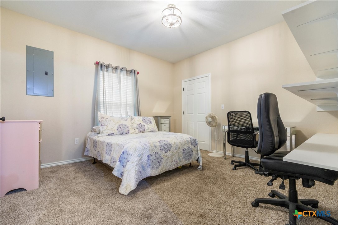 114 Deer Run Moody, TX 76557 - Photo 25 of 40 Guest Bedroom with 2 entry doors (one from master bedroom, and one from hall). Could be used as a baby's room, craft room, or an office. Closet is to the right of the bed.