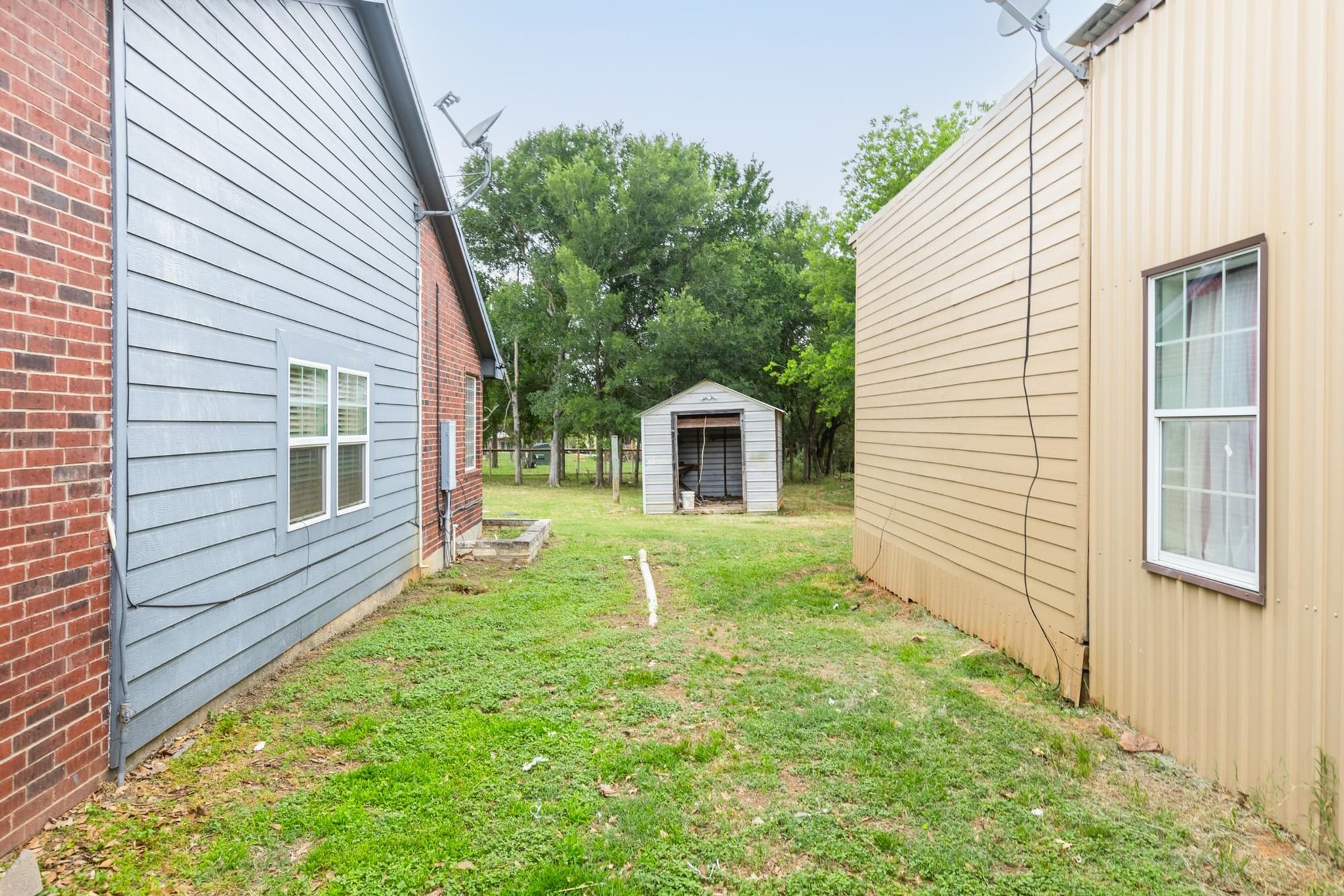 176 Old Lexington Road, Unit C Elgin, TX 78621 - Photo 22 of 31 a view of house with backyard