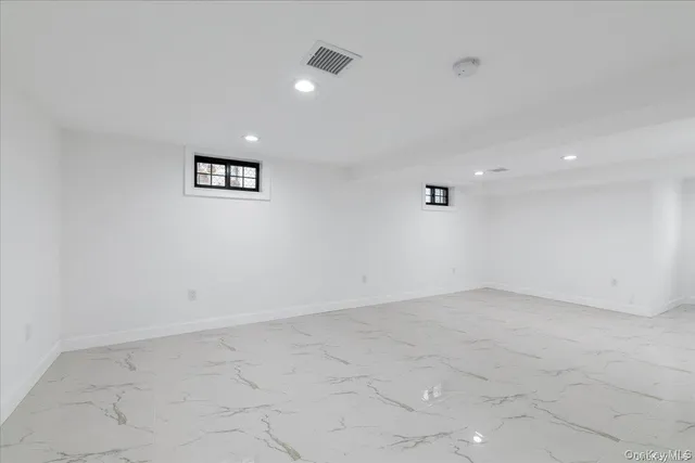 an empty room with a ceiling fan
