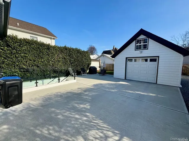 a view of a house with a yard and garage