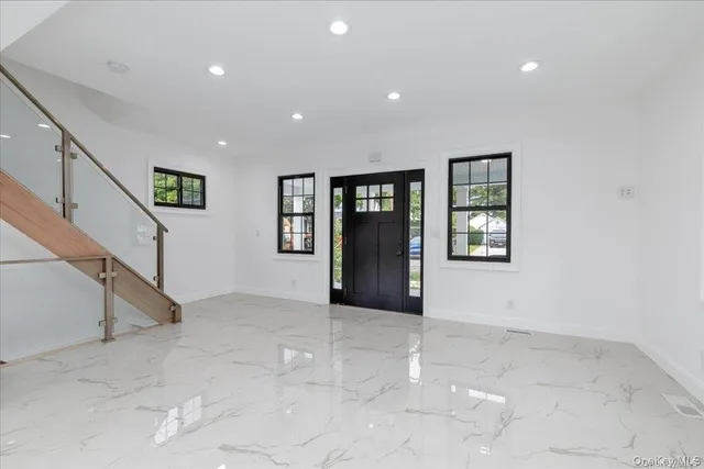a view of livingroom with window and stairs