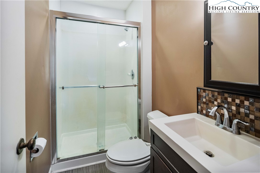 212 Carriage Lamp Court Boone, NC 28607 - Photo 16 of 29 a bathroom with a sink toilet and shower