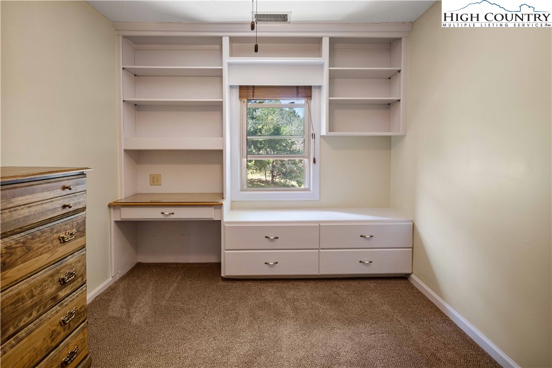 212 Carriage Lamp Court Boone, NC 28607 - Photo 17 of 29 a room with a bunk bed and a window