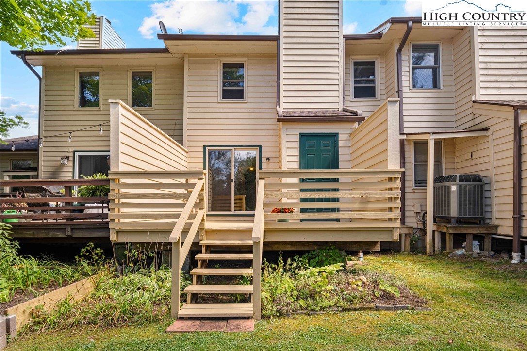 212 Carriage Lamp Court Boone, NC 28607 - Photo 26 of 29 a view of a house with backyard and a chairs