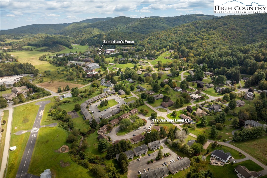 212 Carriage Lamp Court Boone, NC 28607 - Photo 27 of 29 a view of a city with mountains in the background