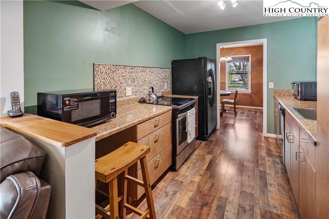 212 Carriage Lamp Court Boone, NC 28607 - Photo 5 of 29 a kitchen that has a table and chairs in it