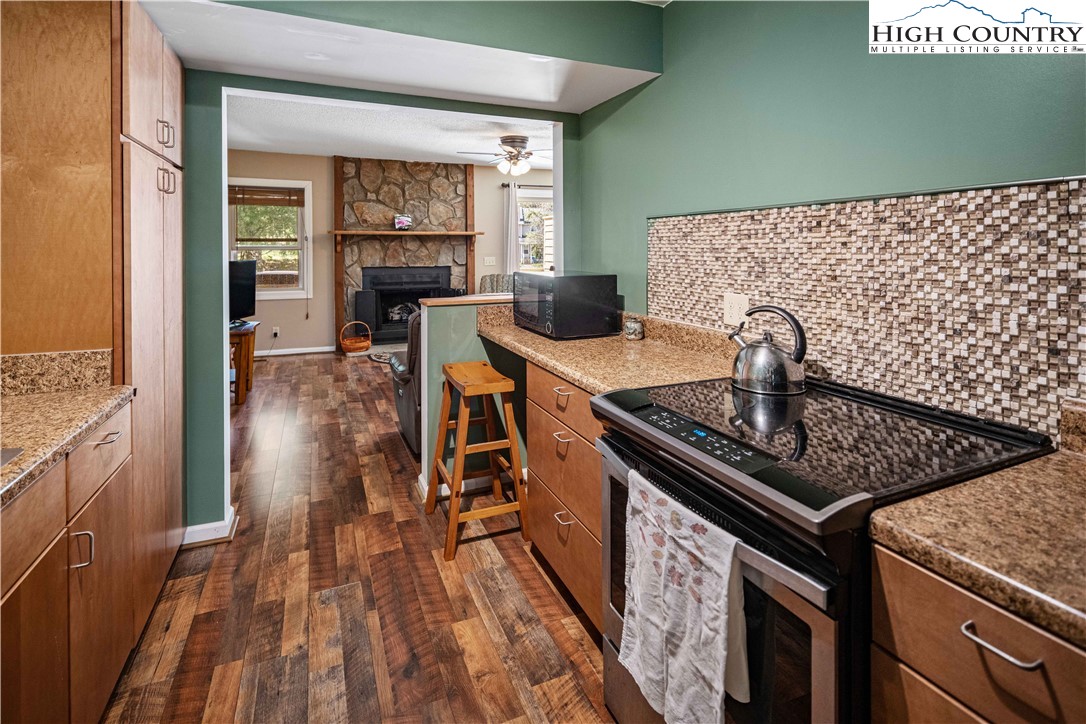 212 Carriage Lamp Court Boone, NC 28607 - Photo 6 of 29 a kitchen with a stove and a sink