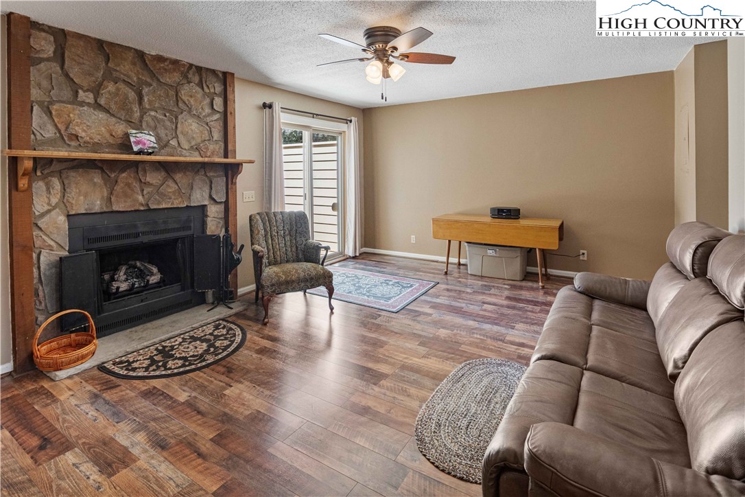212 Carriage Lamp Court Boone, NC 28607 - Photo 7 of 29 a living room with furniture and a fireplace
