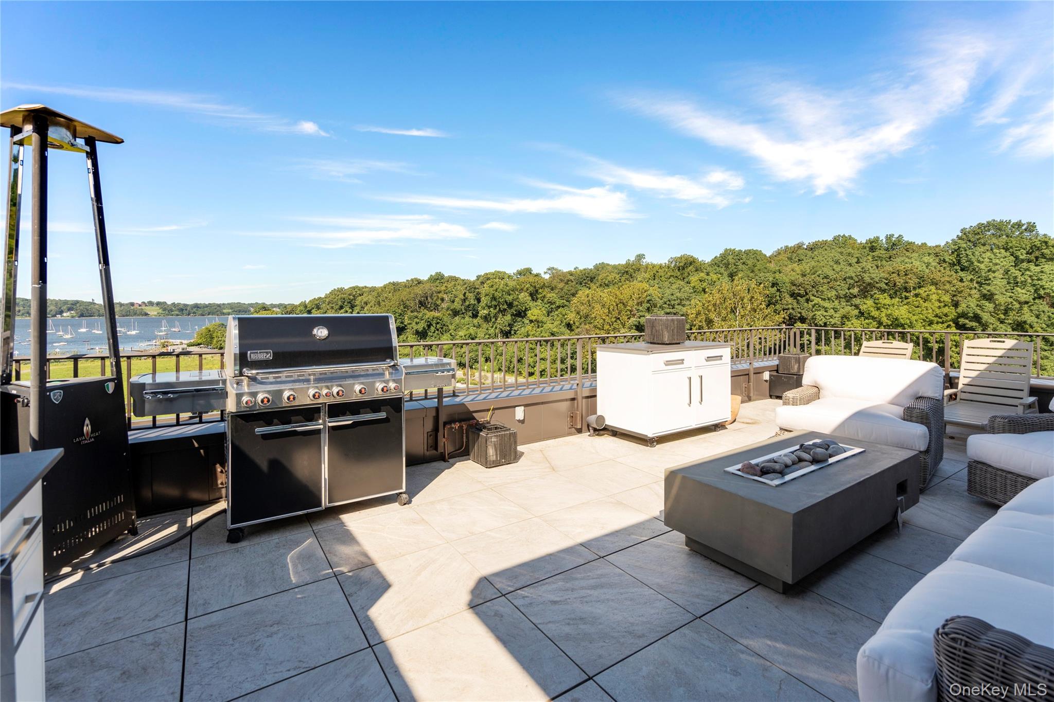 100 Garvies Point Road, Unit 1309 Glen Cove, NY 11542 - Photo 19 of 36 View of rooftop terrace with an outdoor kitchen and a water view