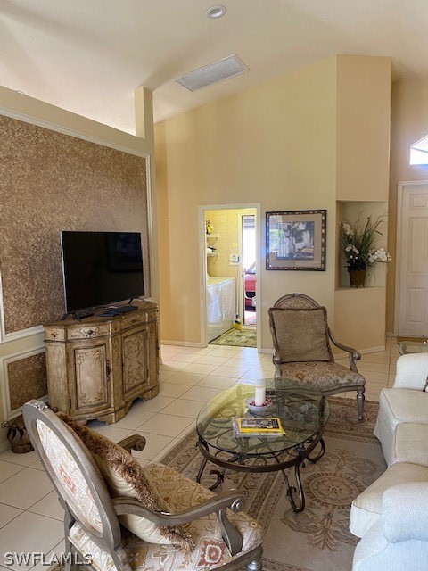 9319 Springview Loop Estero, FL 33928 - Photo 11 of 23 a living room with furniture and a flat screen tv