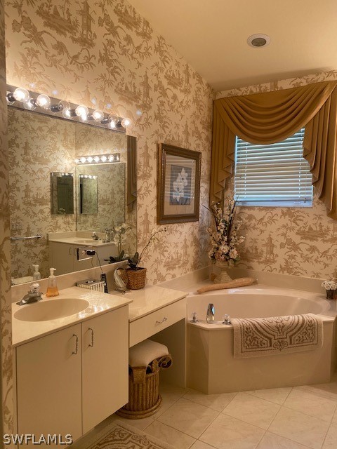 9319 Springview Loop Estero, FL 33928 - Photo 16 of 23 a bathroom with a sink a bathtub and a mirror