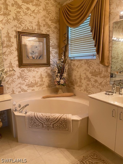 9319 Springview Loop Estero, FL 33928 - Photo 17 of 23 a bathroom with a bathtub and a sink