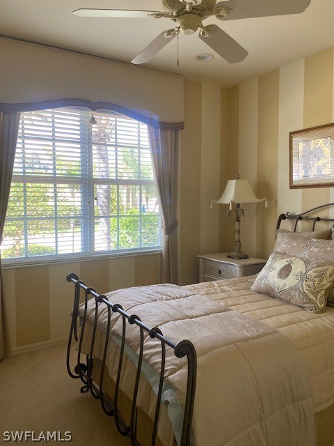 9319 Springview Loop Estero, FL 33928 - Photo 20 of 23 a bedroom with a bed and a window