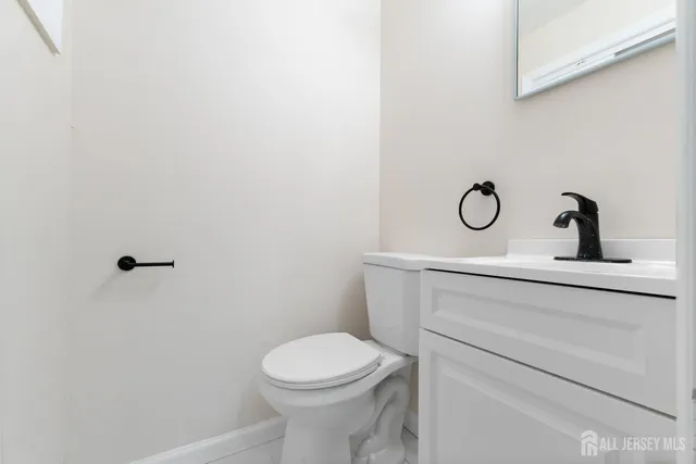 a bathroom with a toilet and a sink
