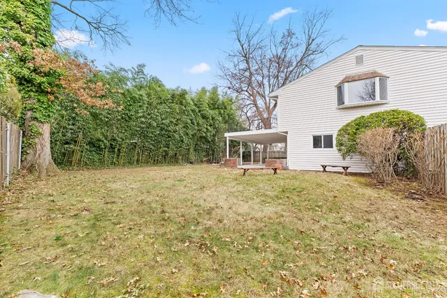 a house that has a tree in front of it