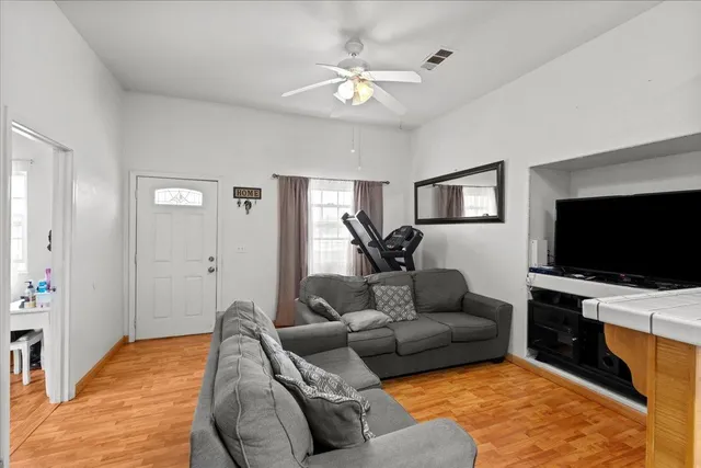 a living room with furniture and a flat screen tv