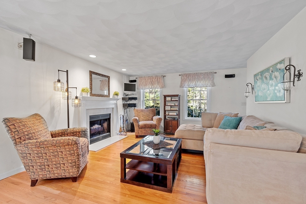 25 Hemlock Road Groton, MA 01450 - Photo 11 of 37 a living room with furniture and a fireplace