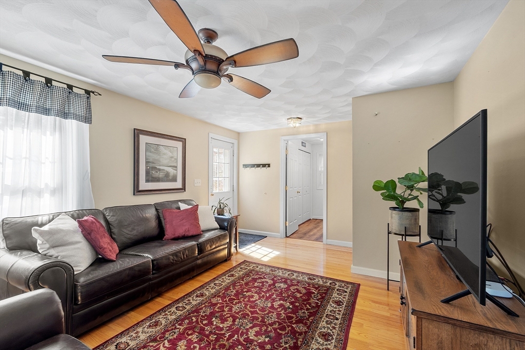 25 Hemlock Road Groton, MA 01450 - Photo 13 of 37 a living room with furniture and a rug