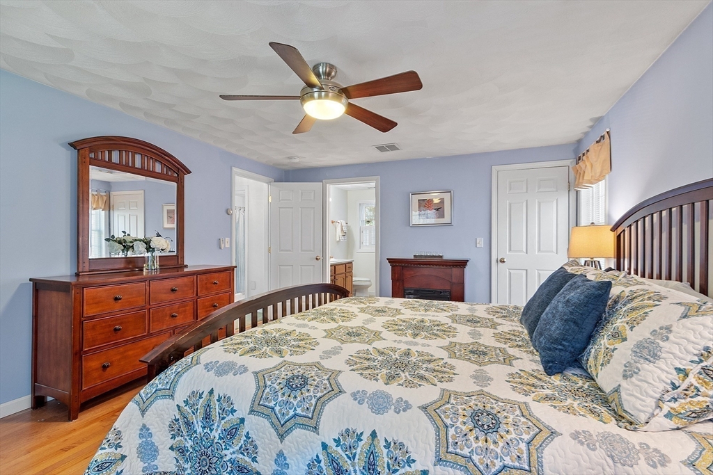25 Hemlock Road Groton, MA 01450 - Photo 16 of 37 a bedroom with a large bed and a dresser