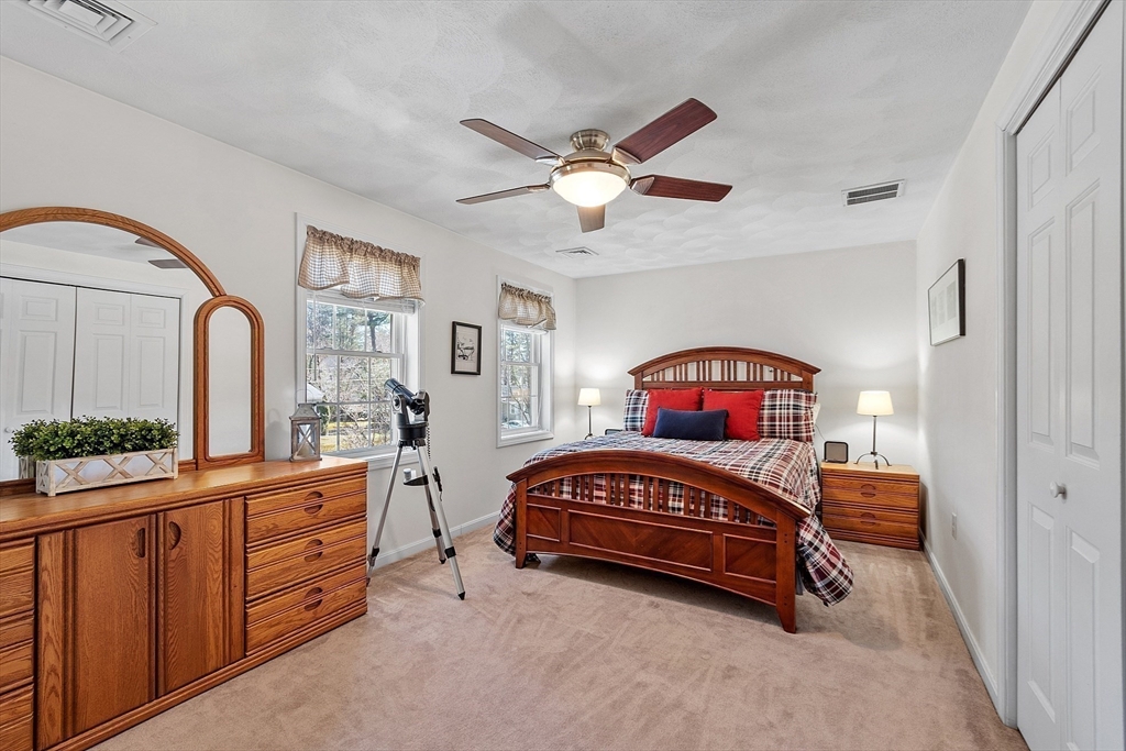 25 Hemlock Road Groton, MA 01450 - Photo 18 of 37 a bedroom with furniture and a window