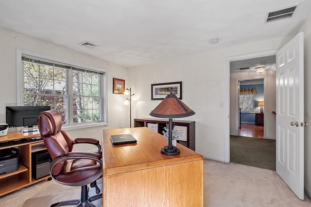 25 Hemlock Road Groton, MA 01450 - Photo 21 of 37 a workspace with furniture and a window