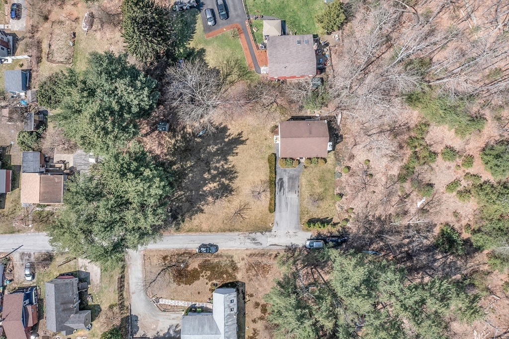 25 Hemlock Road Groton, MA 01450 - Photo 3 of 37 an aerial view of a house with a yard and trees