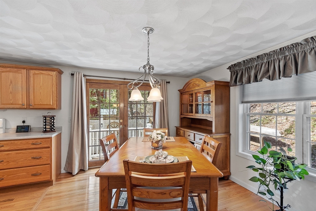 25 Hemlock Road Groton, MA 01450 - Photo 7 of 37 a dining room with furniture window and wooden floor