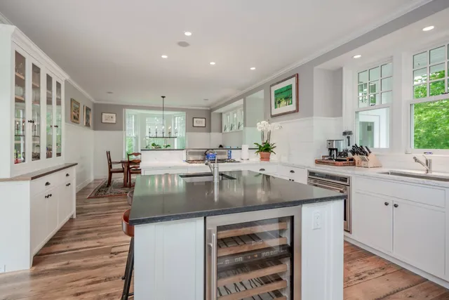 a kitchen with stainless steel appliances granite countertop a stove and a sink