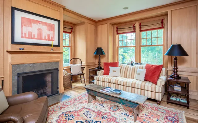 a living room with furniture and a fireplace