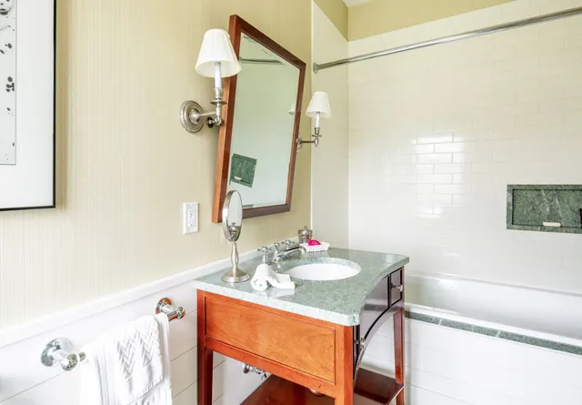 a dining room with a table and chairs