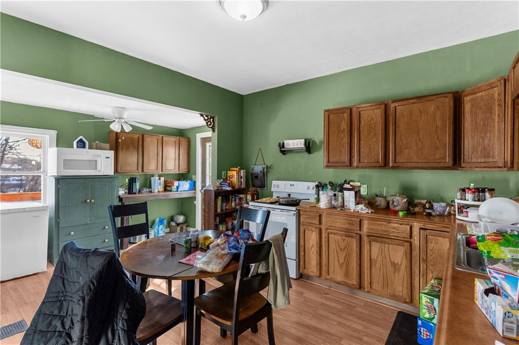 374 Harrison Street Sharon, PA 16146 - Photo 12 of 26 a view of a dining room with furniture and wooden floor