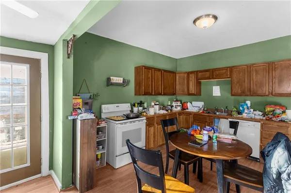 a kitchen with a dining table and chairs