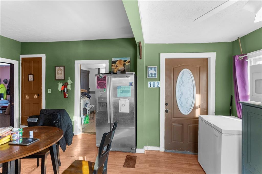 374 Harrison Street Sharon, PA 16146 - Photo 14 of 26 a dining room with furniture and a mirror