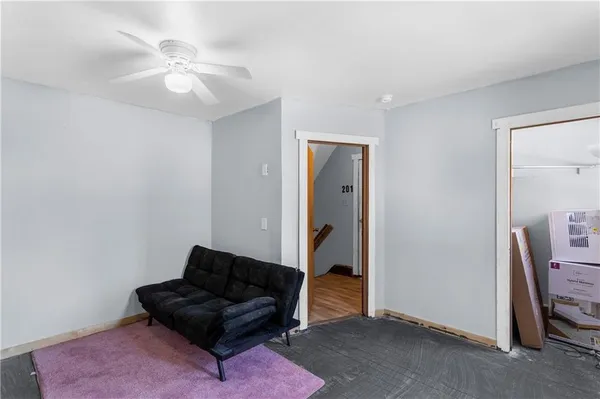 a living room with furniture and a lamp