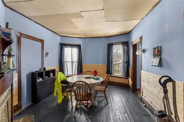 a dining room with furniture and window