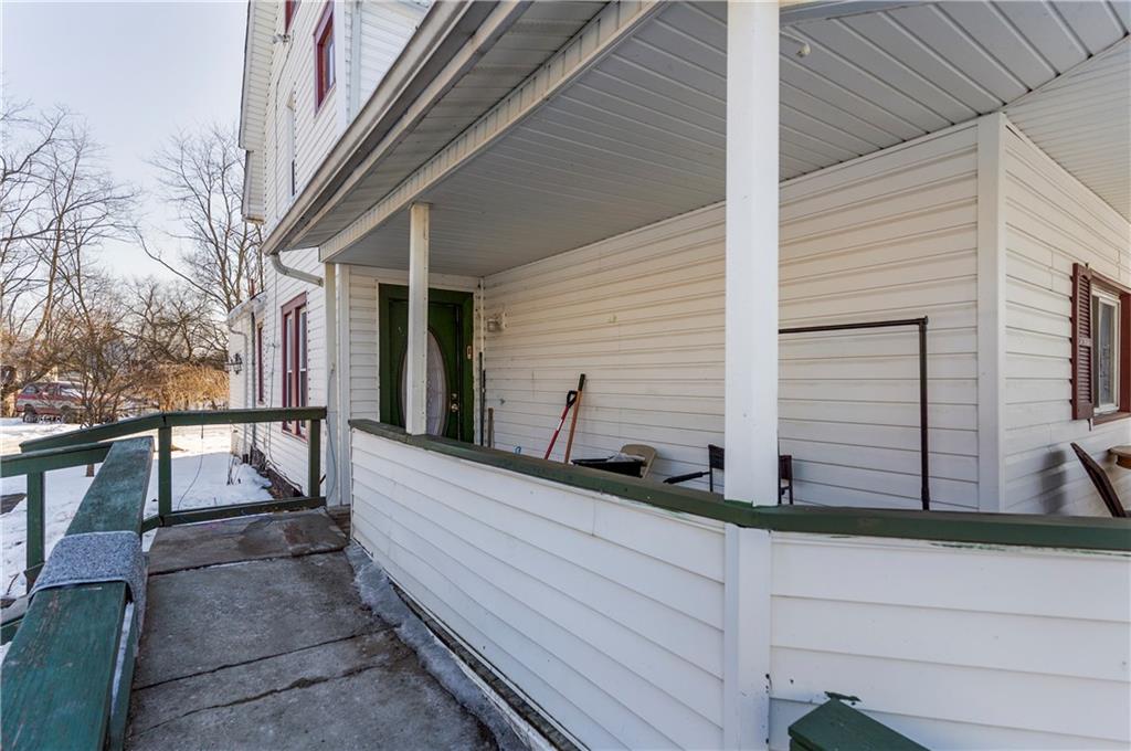 374 Harrison Street Sharon, PA 16146 - Photo 7 of 26 a view of house with wooden floor and fence and a bench