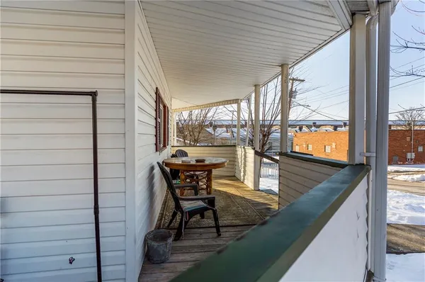 a view of a two chairs in the balcony