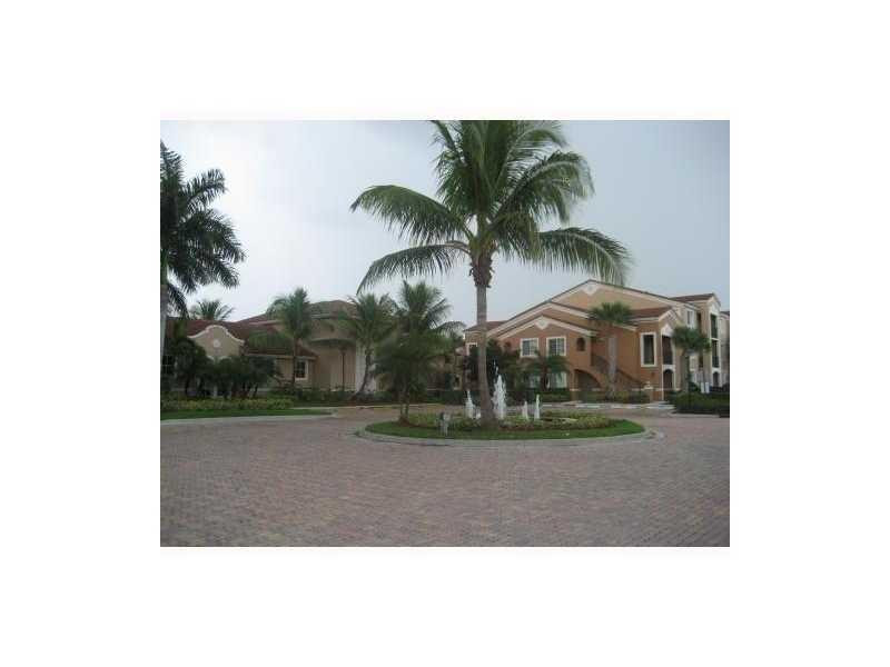 7940 North Nob Hill Road, Unit 204 Tamarac, FL 33321 - Photo 9 of 10 a view of a palm trees in front of a building