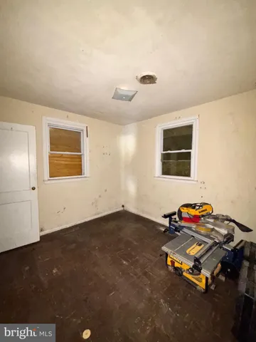 a view of a backyard with a large tree