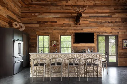 a view of a dining room with furniture and window