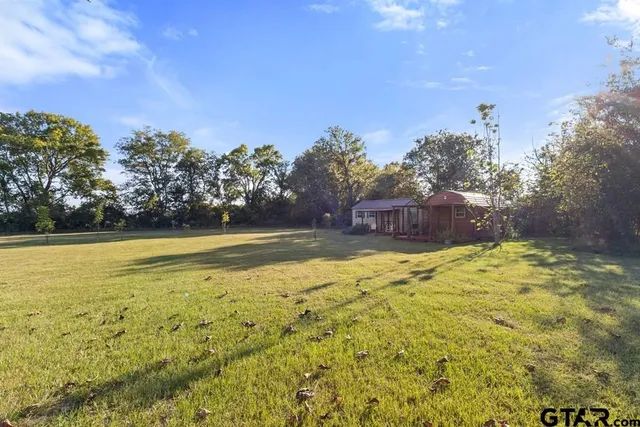 a view of a swimming pool with an outdoor space and seating area
