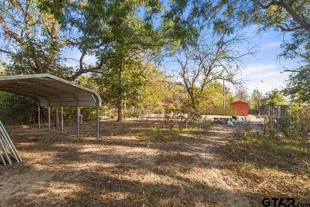 a backyard of a house with lots of green space