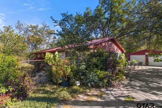 a backyard of a house with lots of green space