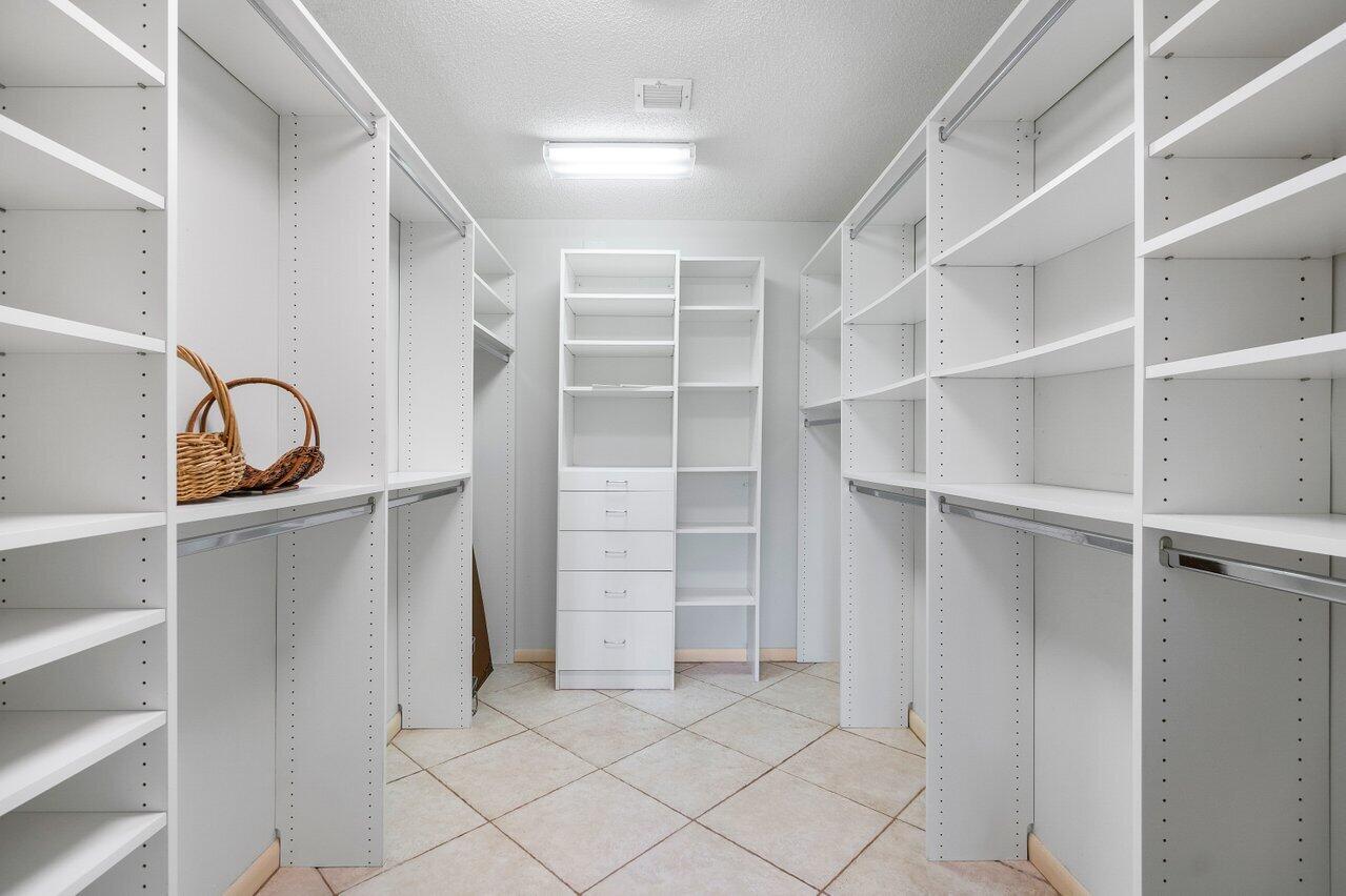 4022 Shell Drake Lane, Unit SHELLDRAKE Boynton Beach, FL 33436 - Photo 16 of 40 a view of an empty walk in closet